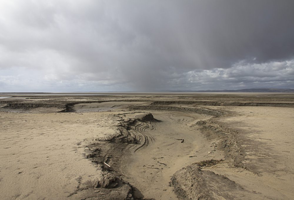 Shifting Channel and Storm - Photograph by Debbie Yare