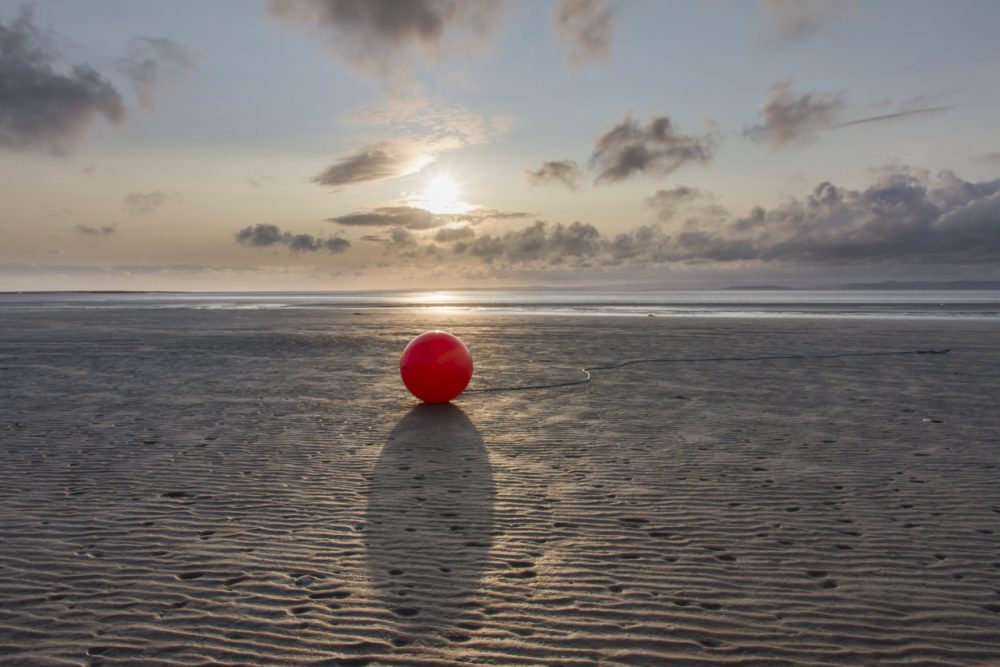 Lost Buoy at Sunset - Photograph by Debbie Yare